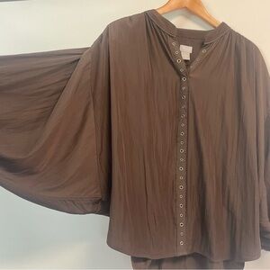 Chicos Dark Brown with gold accent brads. Sort of a poncho/bat wing style.